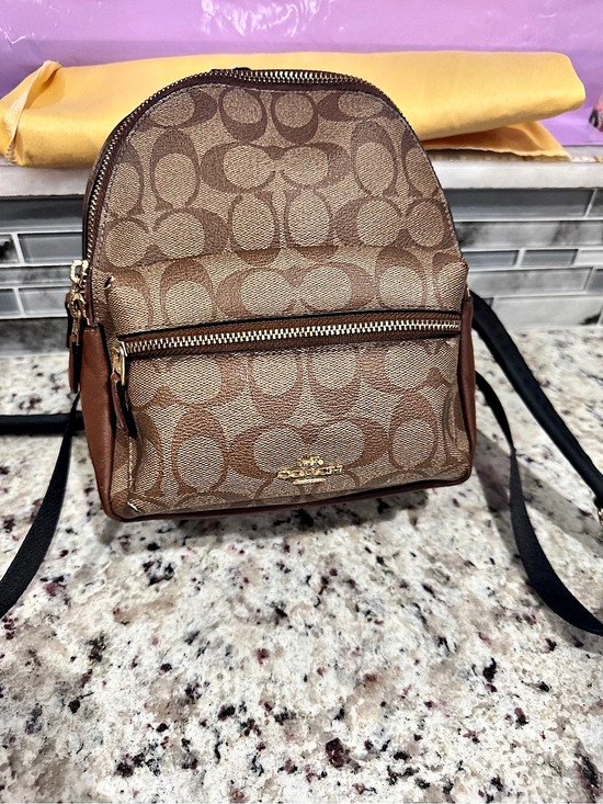 Coach Handbags - Coach Mini Charlie Backpack in Signature Canvas Brown & Tan